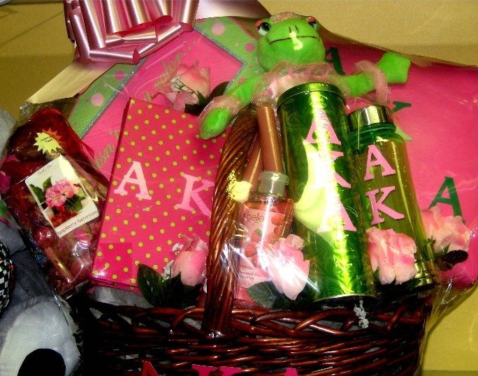 Alpha Kappa Alpha pink and green sorority basket with cups, plush frog, and gifts