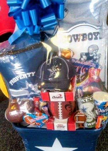 Dallas Cowboys fan basket with cap, popcorn, and fan gear