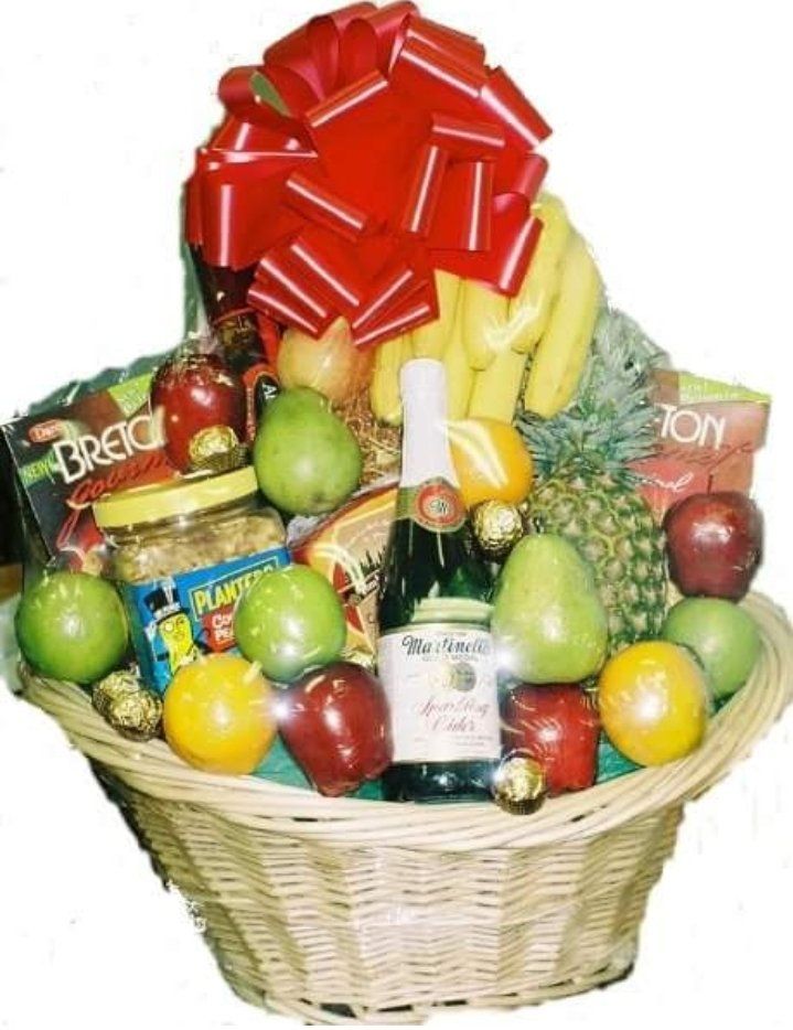 Fresh fruit gift basket with apples, oranges, and grapes