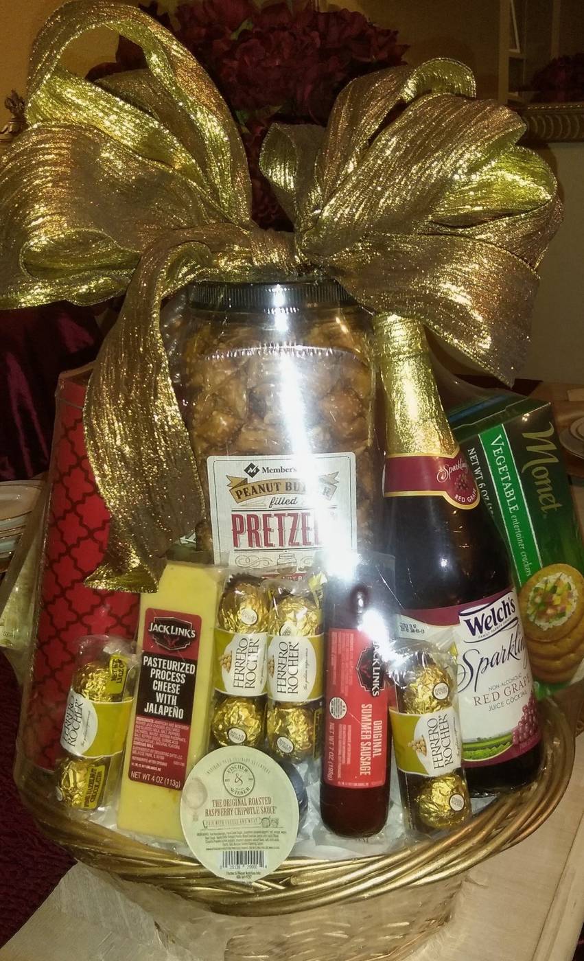 Gourmet gift basket with sparkling red grape juice, pretzels, cheese, and sausage