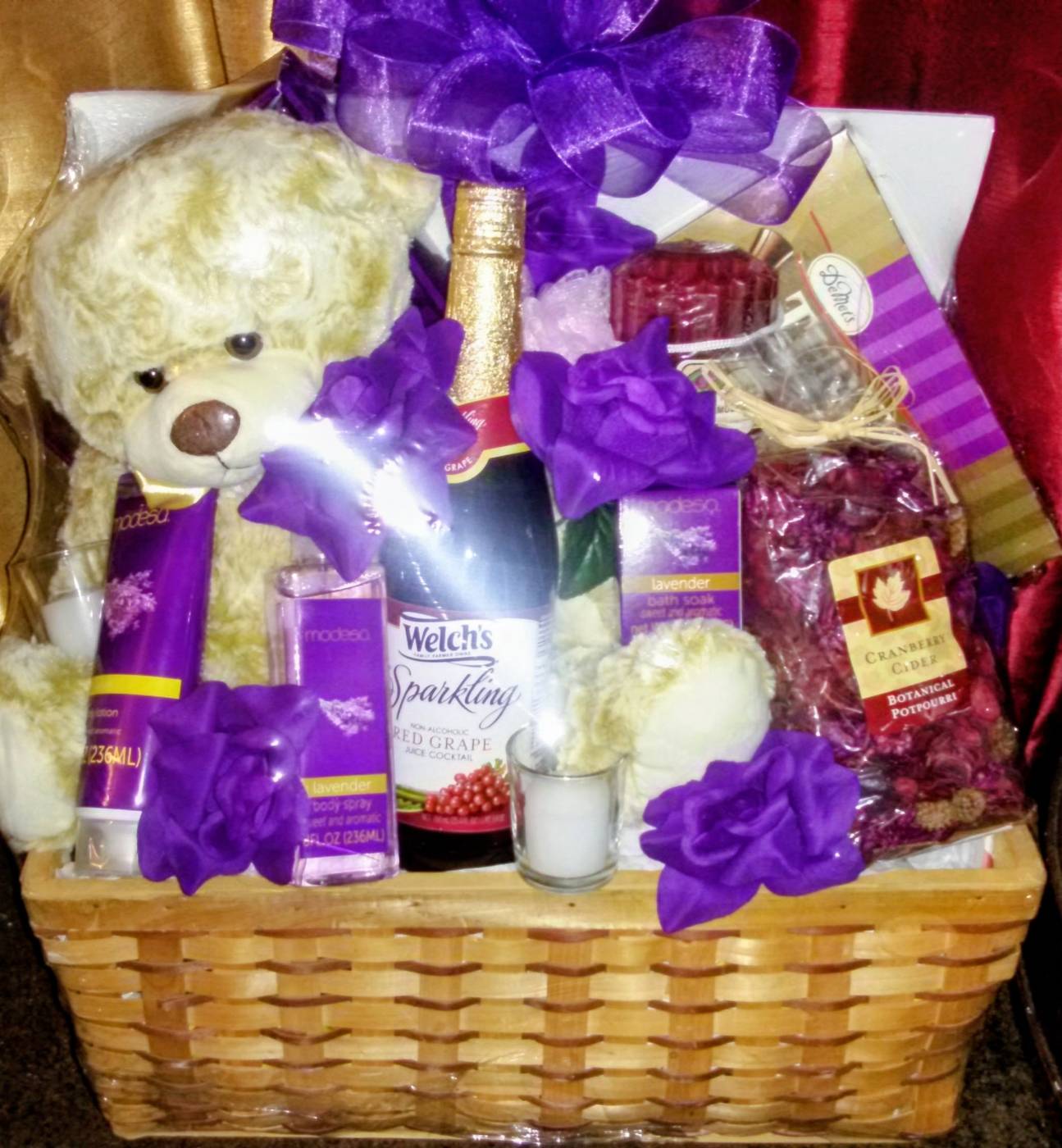 Lavender romance basket with teddy bear, sparkling wine, lotion, and chocolates