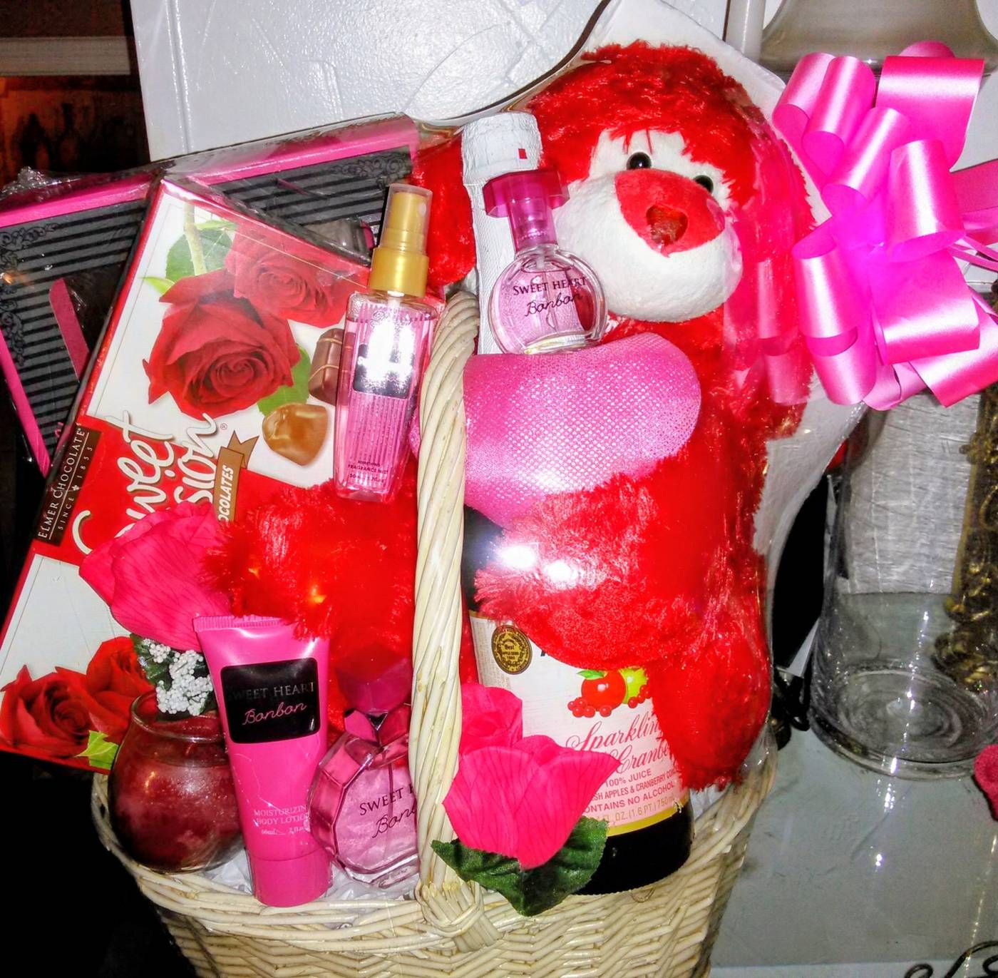 Sweetheart romance basket with red roses, teddy bear, and bath products