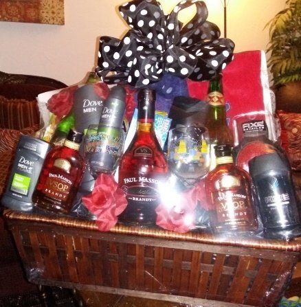 Men's ultimate gift basket with spirits, grooming products, snacks, and cash