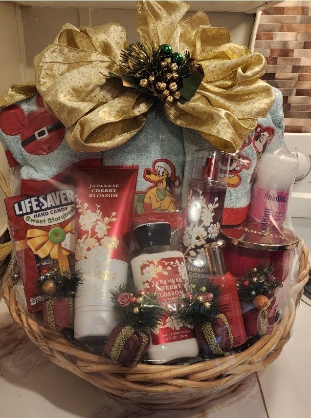 Holiday spa basket with body lotion, candle, chocolate Santa, and ornaments