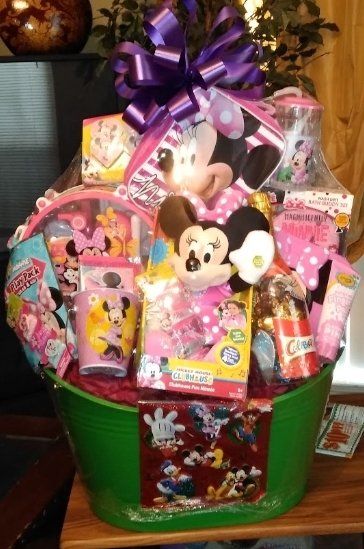 Mickey and Minnie gift basket with plush, clock, and treats