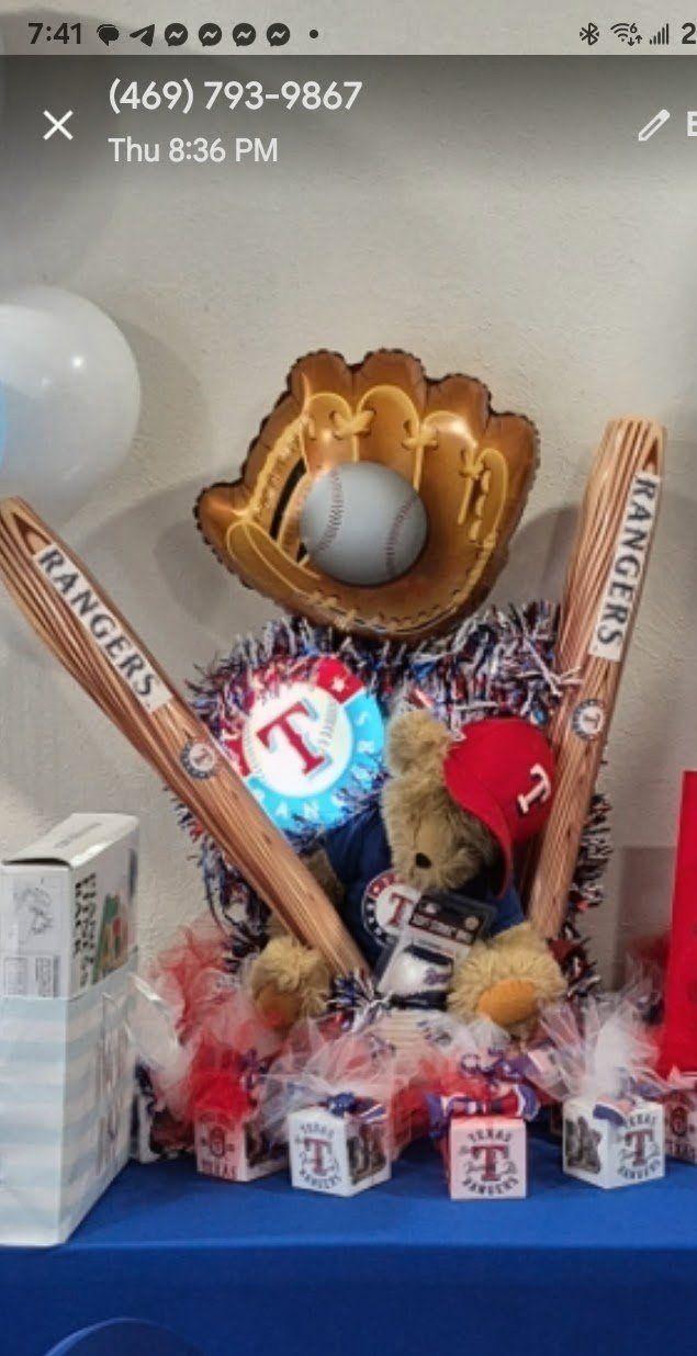 Texas Rangers baseball gift arrangement with teddy bear, bats, and team boxes