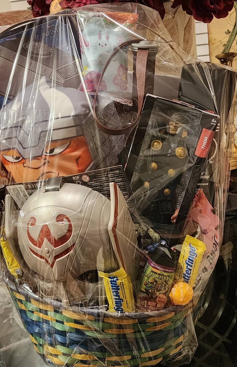 Thor gift basket with mask, hammer, and treats