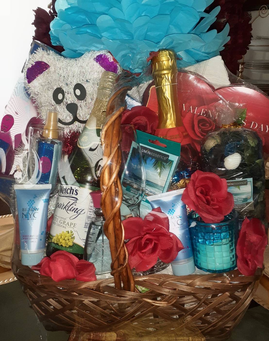 Turquoise Valentine basket with teddy bear, sparkling grape juice, and lotions