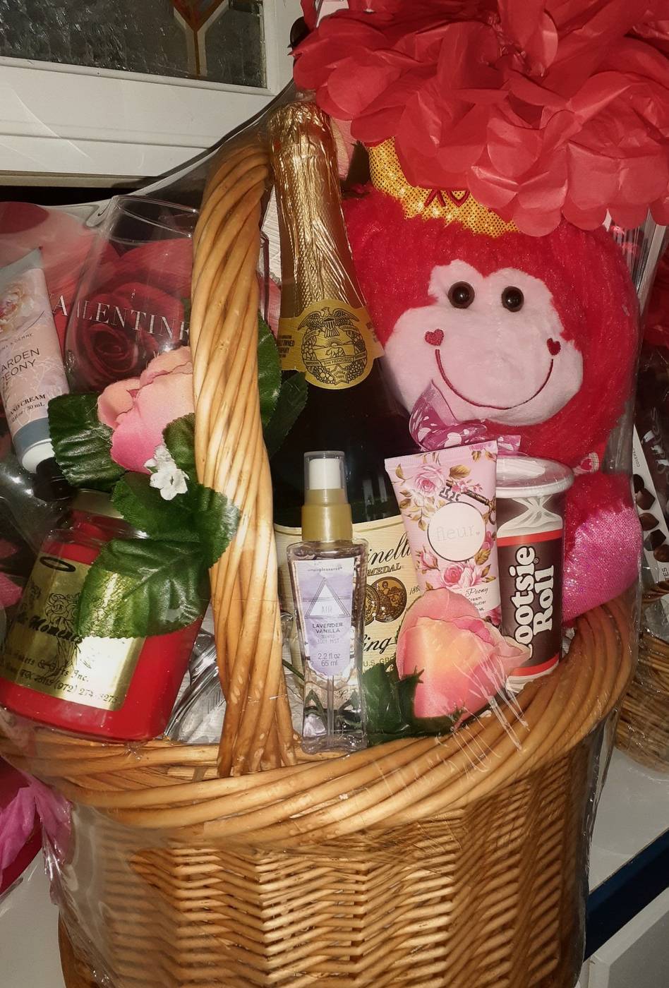 Valentine basket with monkey plush, sparkling cider, lotion, and roses