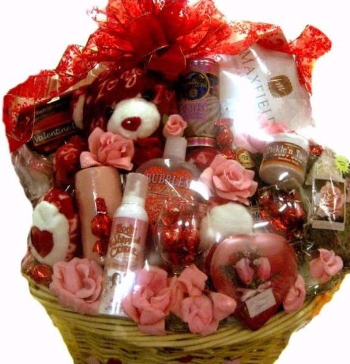 Pink Valentine basket with teddy bear, body spray, and chocolates