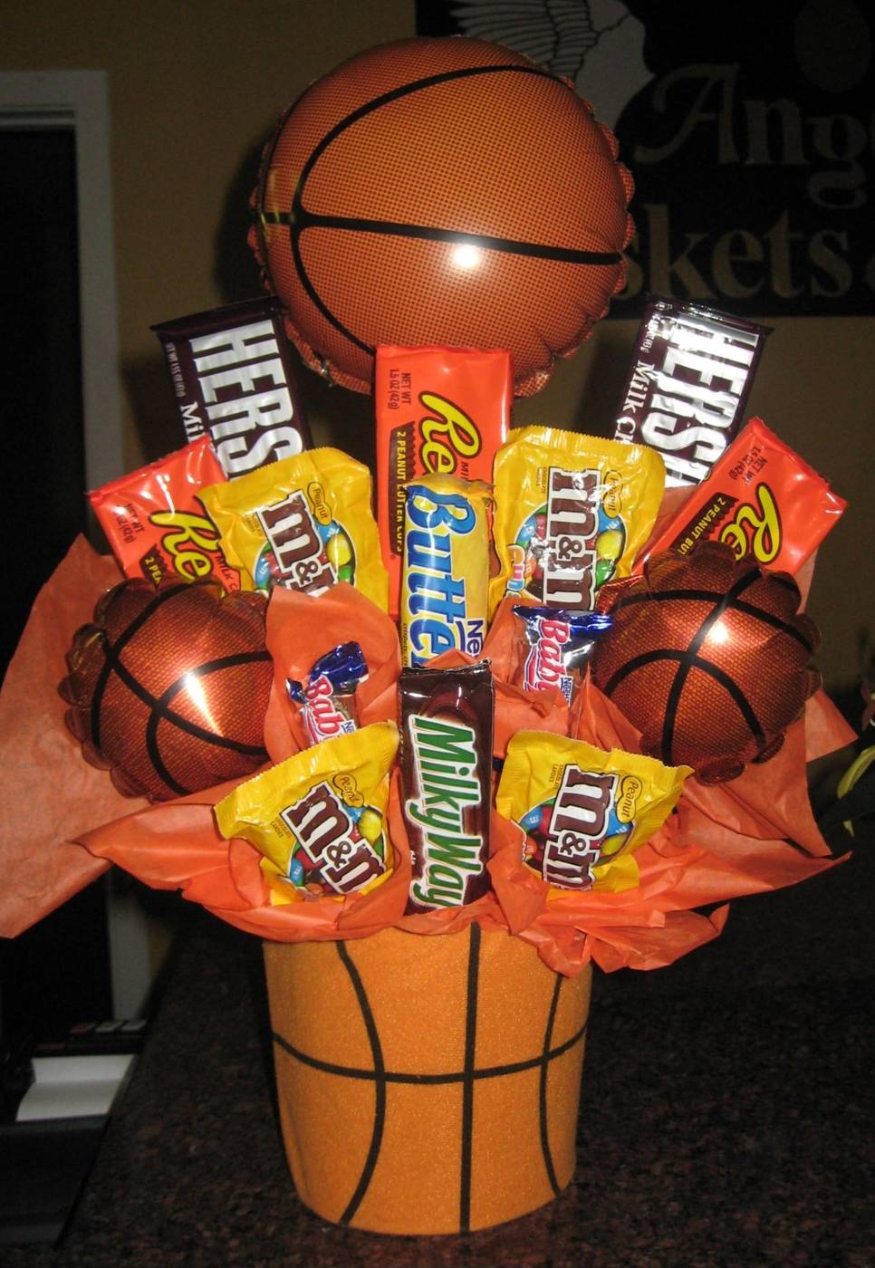 Basketball candy bouquet with Hershey's, Reese's, M&Ms and a basketball balloon