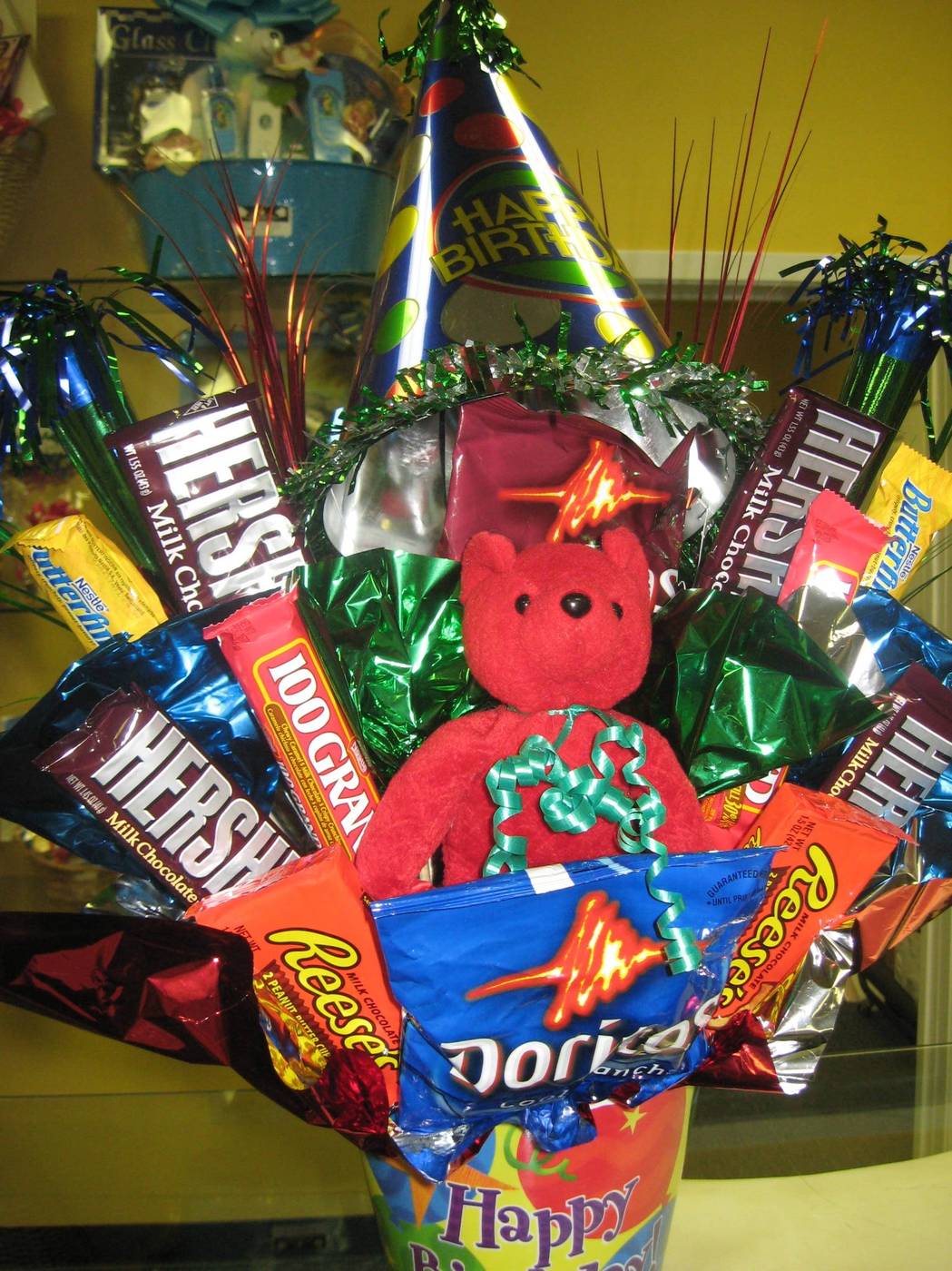 Happy Birthday snack and candy bouquet with teddy bear and party hat