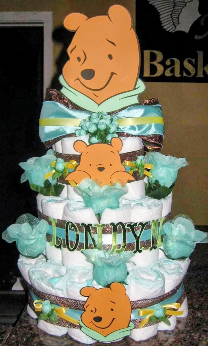 Winnie the Pooh diaper cake with mint green ribbons and flowers