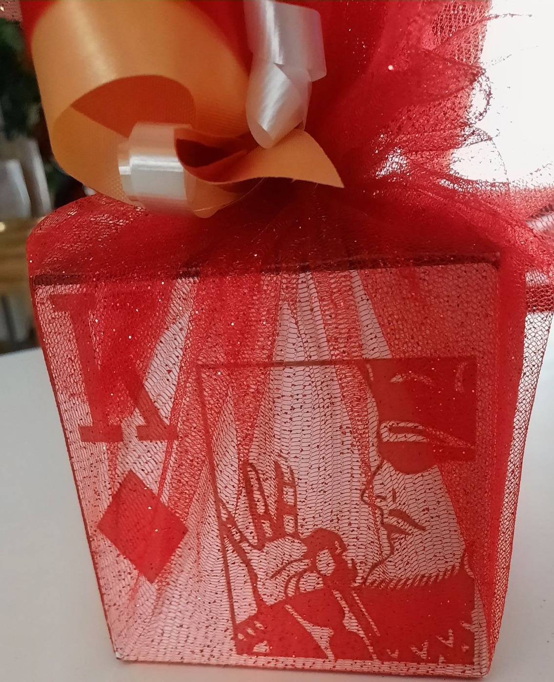 Red K diamond party favor box with ribbons