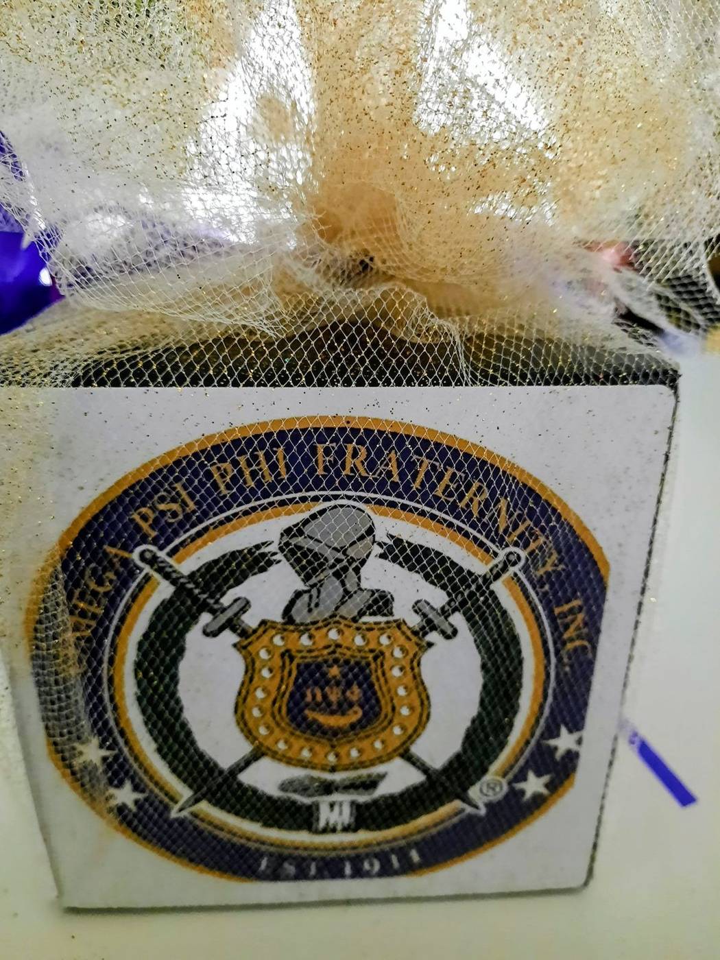 Omega Psi Phi crest purple and gold party favor box