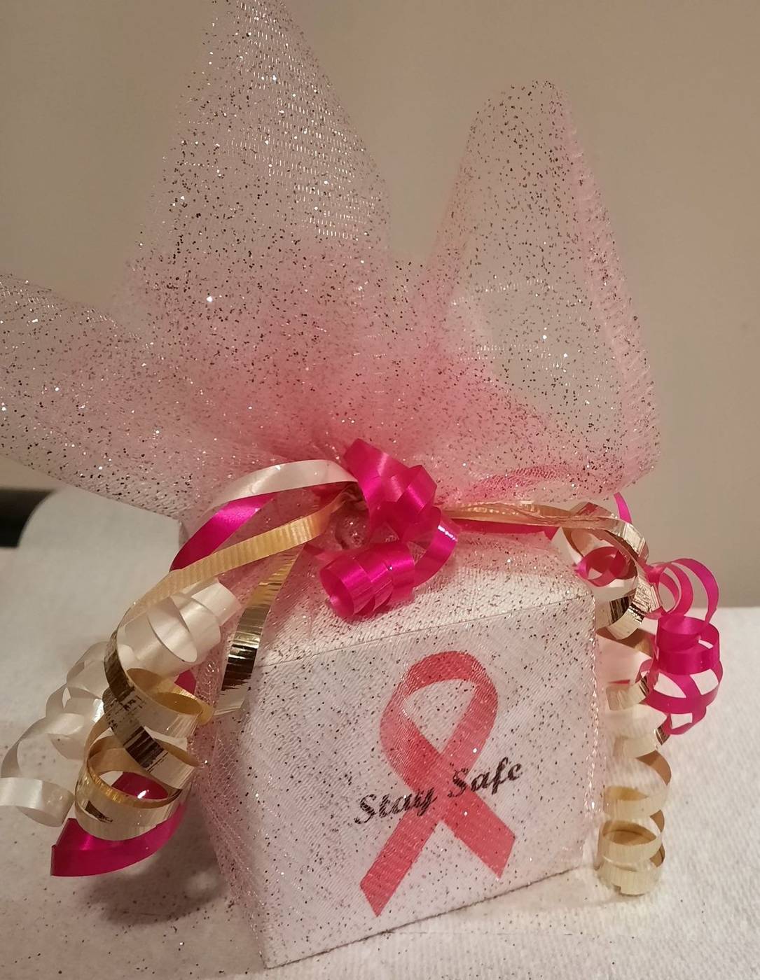 Pink ribbon Stay Safe party favor box with glitter and curling ribbons