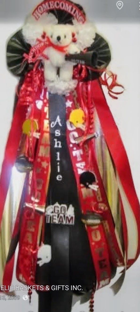 Red and black homecoming mum with teddy bear, megaphone and go team ribbons