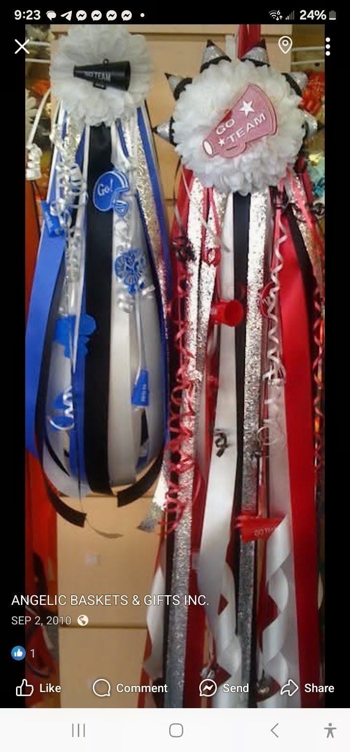 Pair of go team homecoming mums in blue silver and pink black
