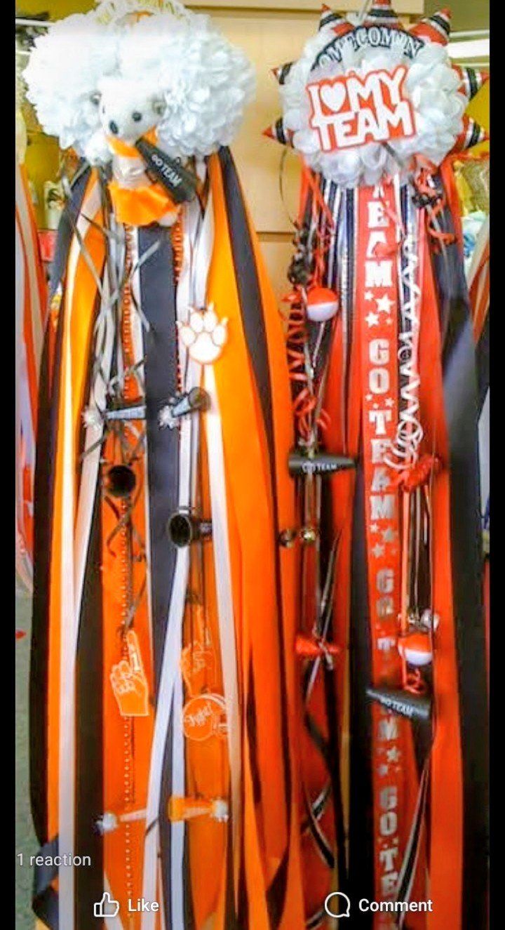 Pair of orange and black homecoming mums with I love my team ribbons