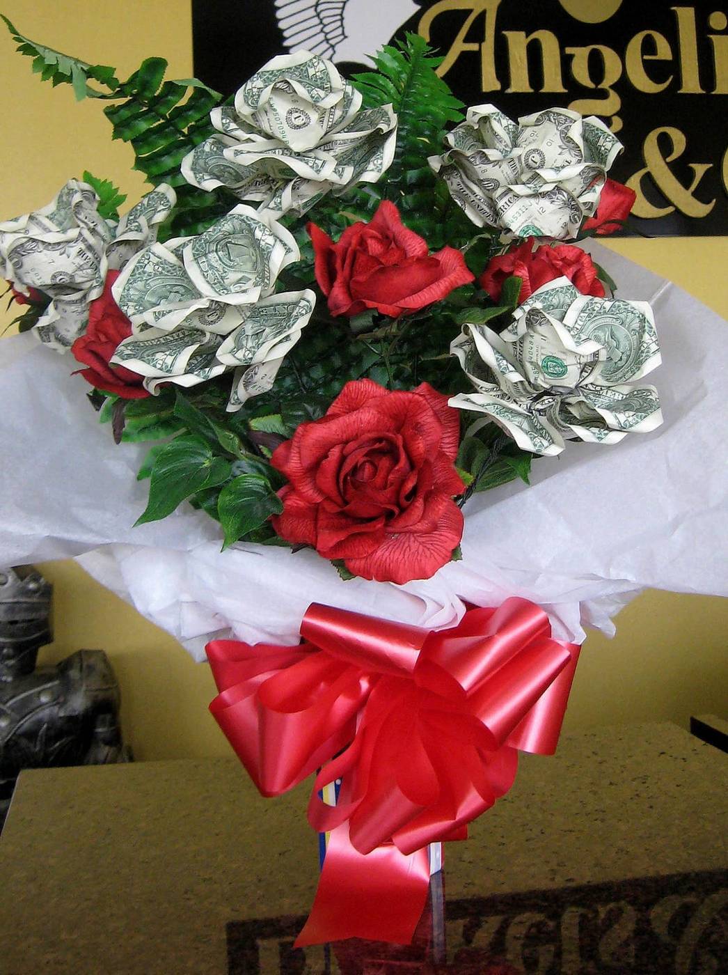 Money rose bouquet with red roses and red bow