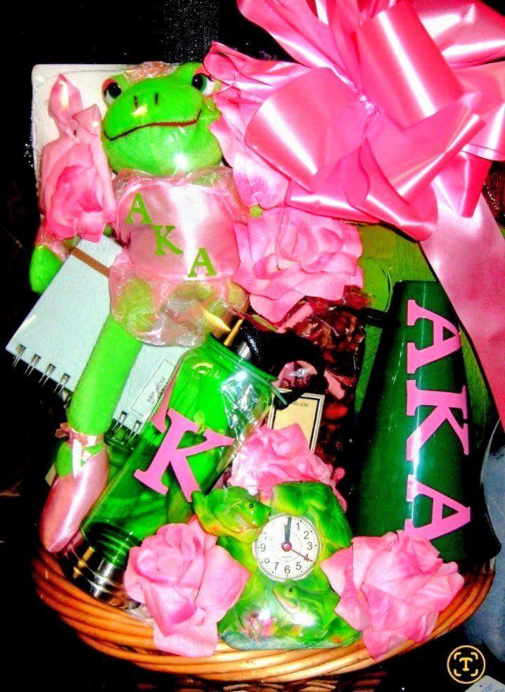 Alpha Kappa Alpha frog-themed gift basket with plush frog, clock, and pink roses