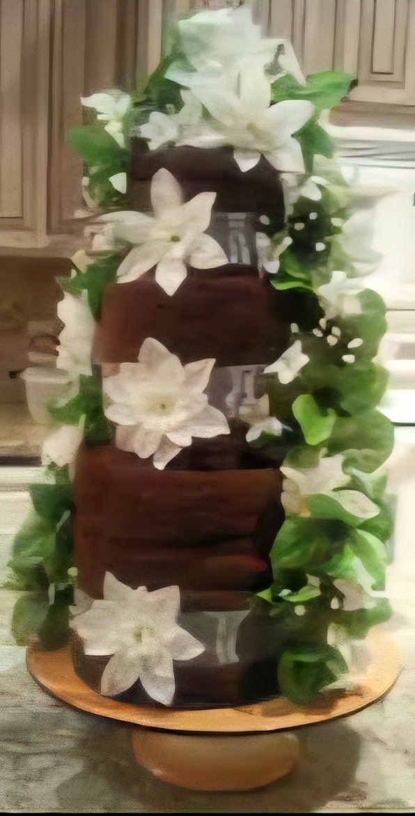 Chocolate brown towel cake with white lilies