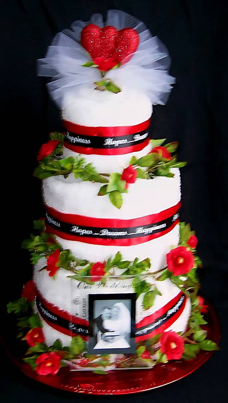 Red, black and white towel cake with heart topper and photo frame