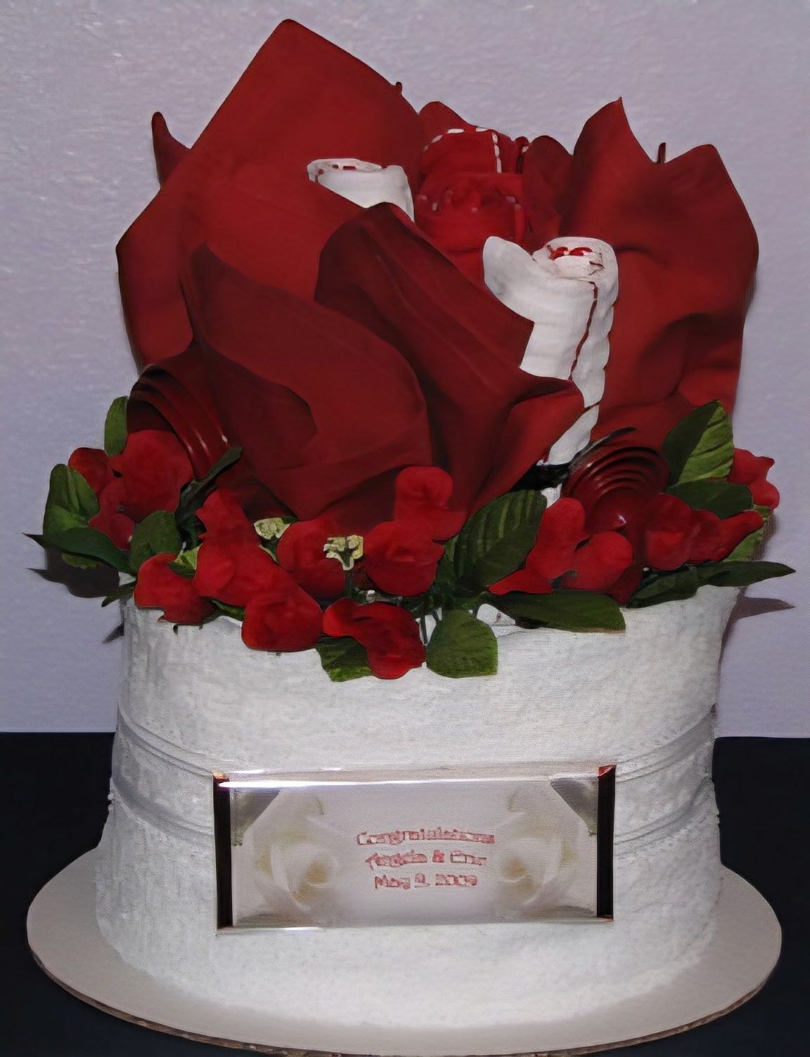 Red rose wedding towel cake with Congratulations plaque